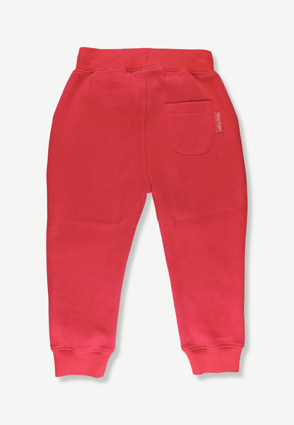 Red sweatpants shown from the back, featuring a wide elastic waistband, a side pocket, and ribbed ankle cuffs, photographed against a light gray background.
