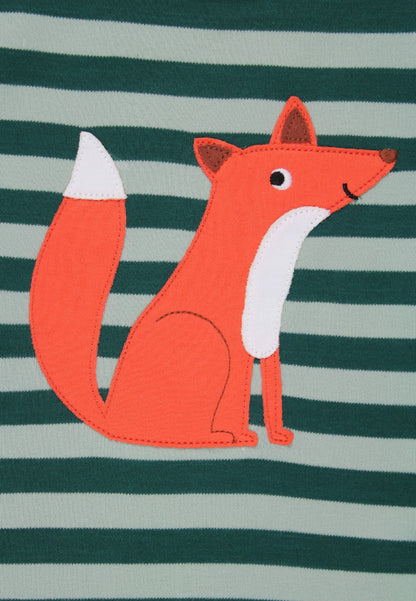 A close-up of a children's garment featuring a stylized orange fox applique with a white chest and white-tipped tail, set against a dark green and light gray striped fabric background.