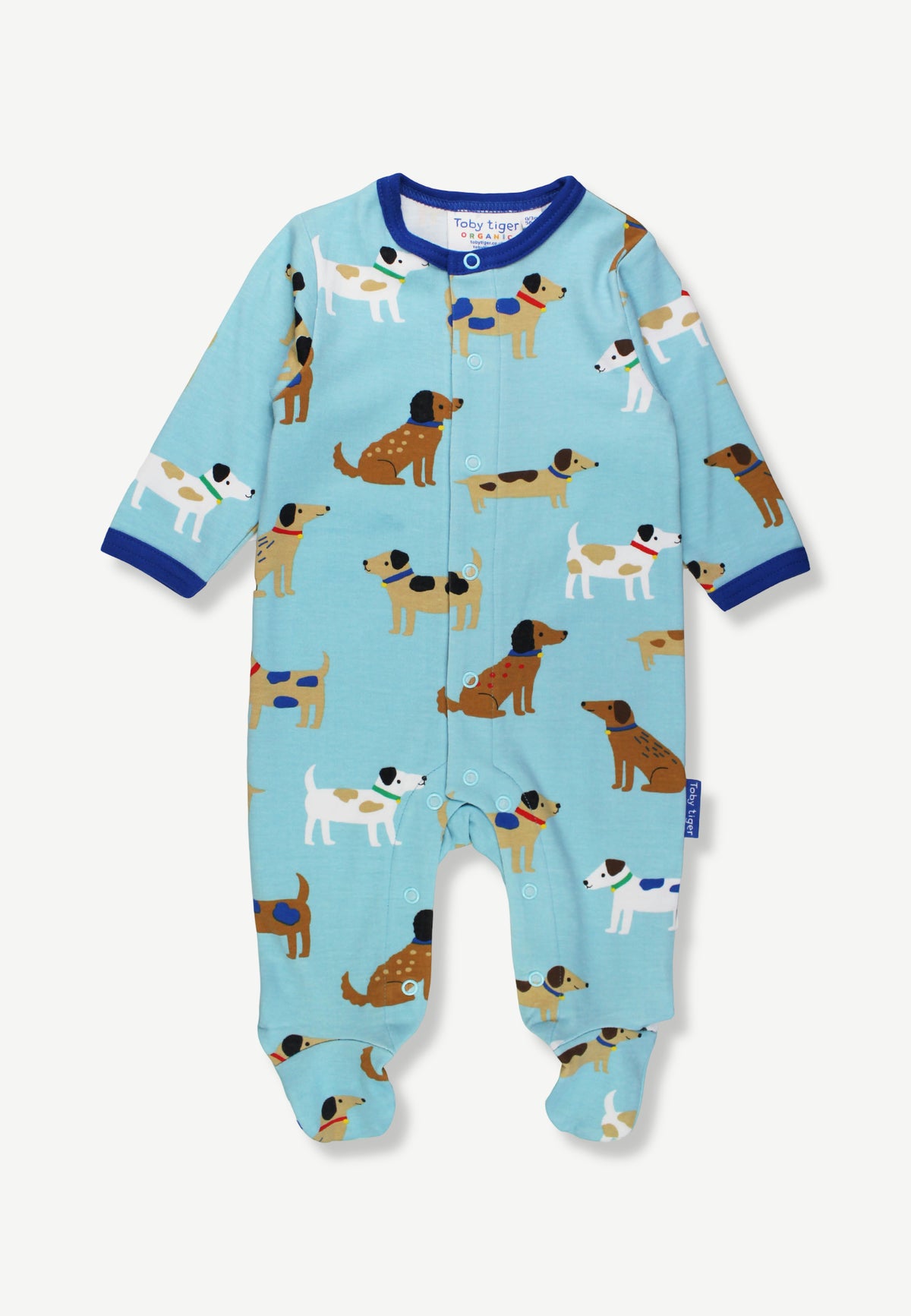 A baby footed sleeper in light blue with an all-over print of cartoon dachshunds, featuring dark blue trim at the collar and cuffs, shown flat on a light background.