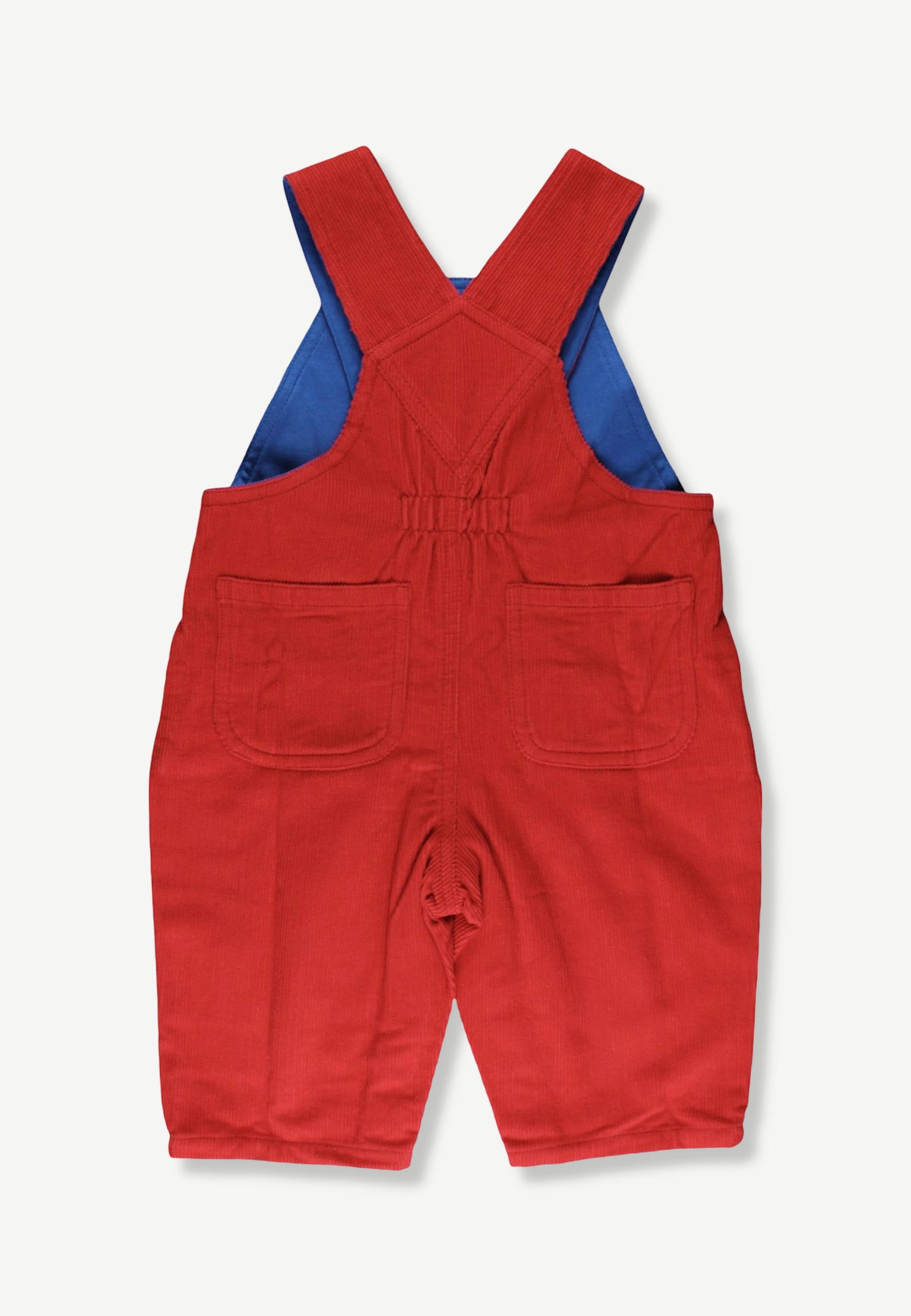 A pair of red corduroy baby overalls with blue inner lining, featuring front patch pockets and adjustable shoulder straps, shown flat on a light gray background.