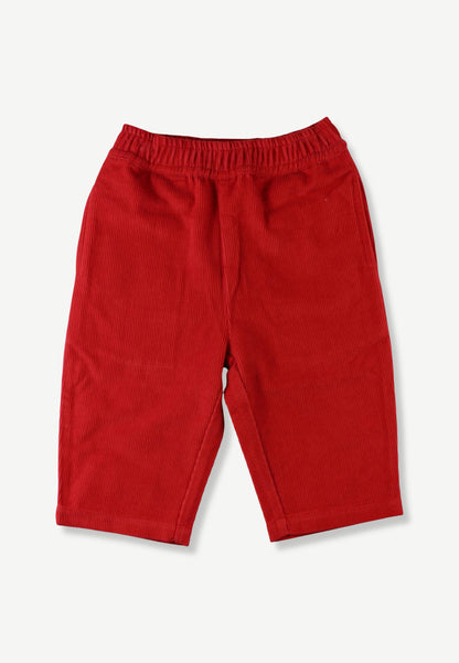 Red corduroy pants for toddlers, featuring an elastic waistband and side pockets, shown flat on a light gray background.